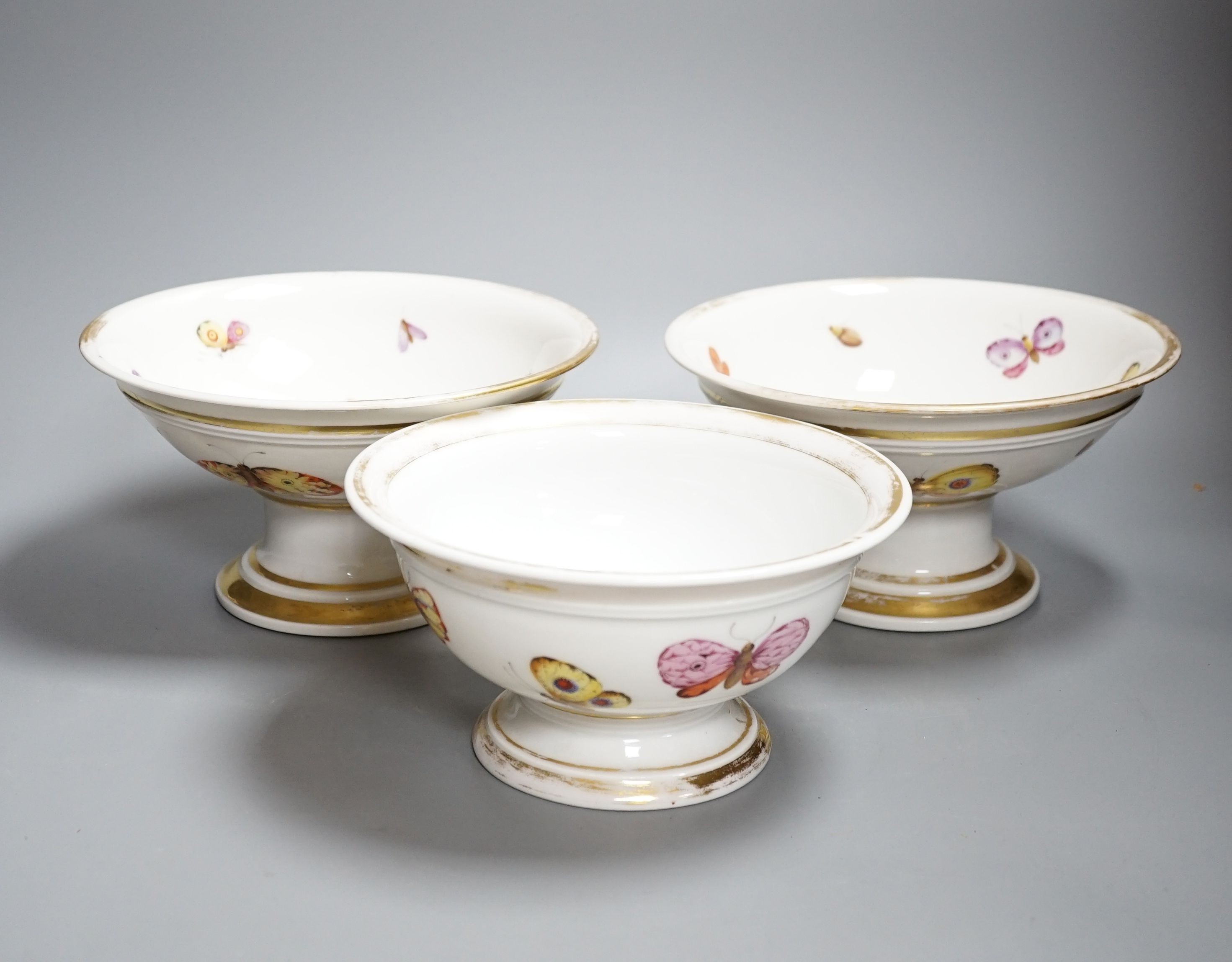 A pair of mid 19th century Paris porcelain ‘butterfly’ comports and similar example (3)